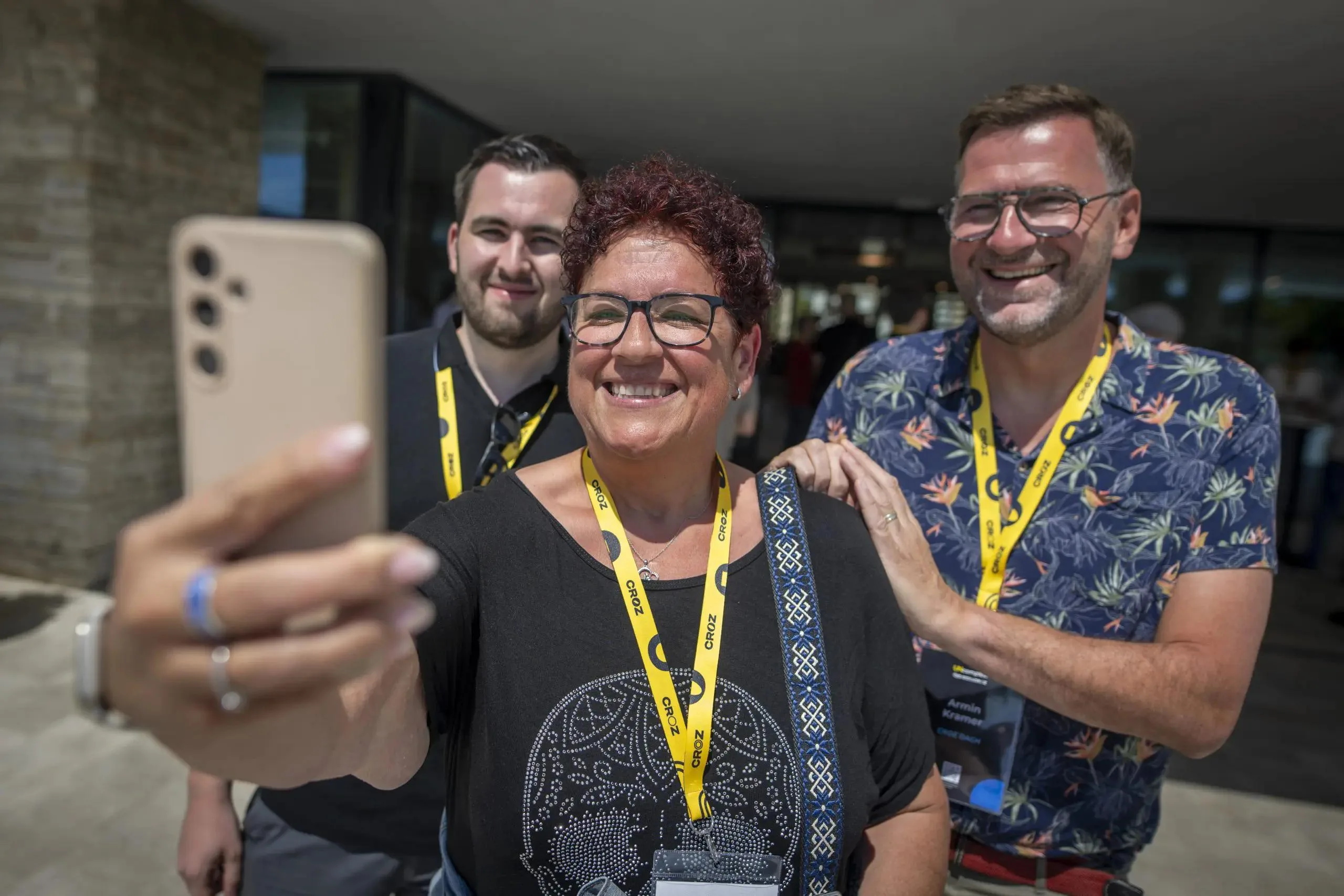 Three QED attendees taking a selfie together