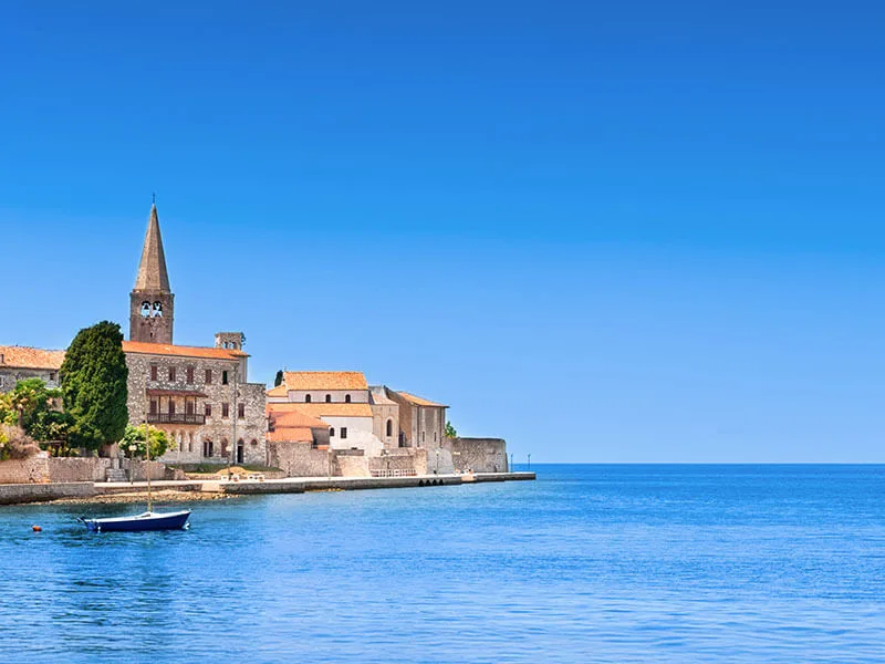 Poreč old town and bell tower seen from the sea